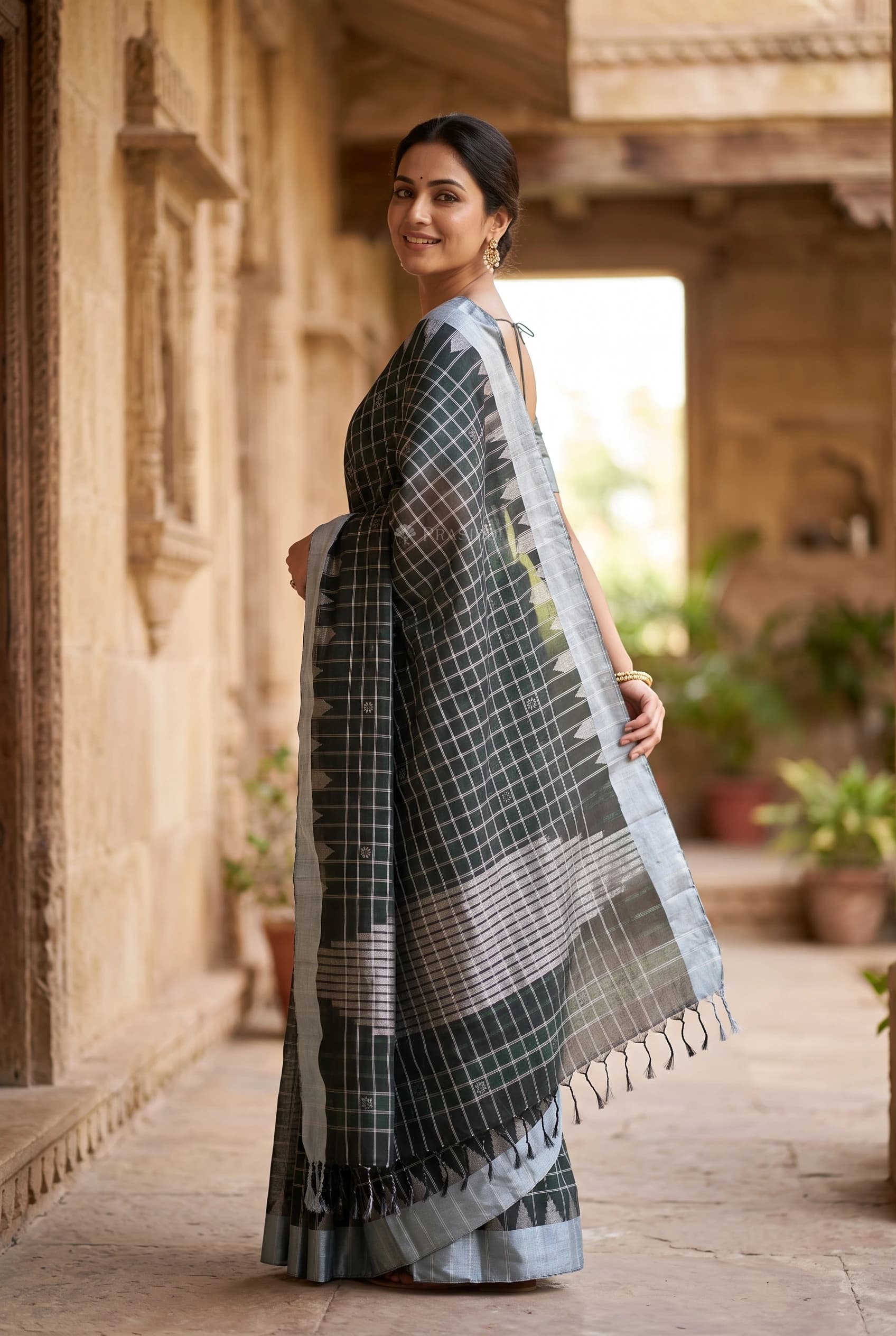 Black and Silver Grey Soft Silk Saree with Contrast Border and Woven Design. – Model Displaying Full Saree