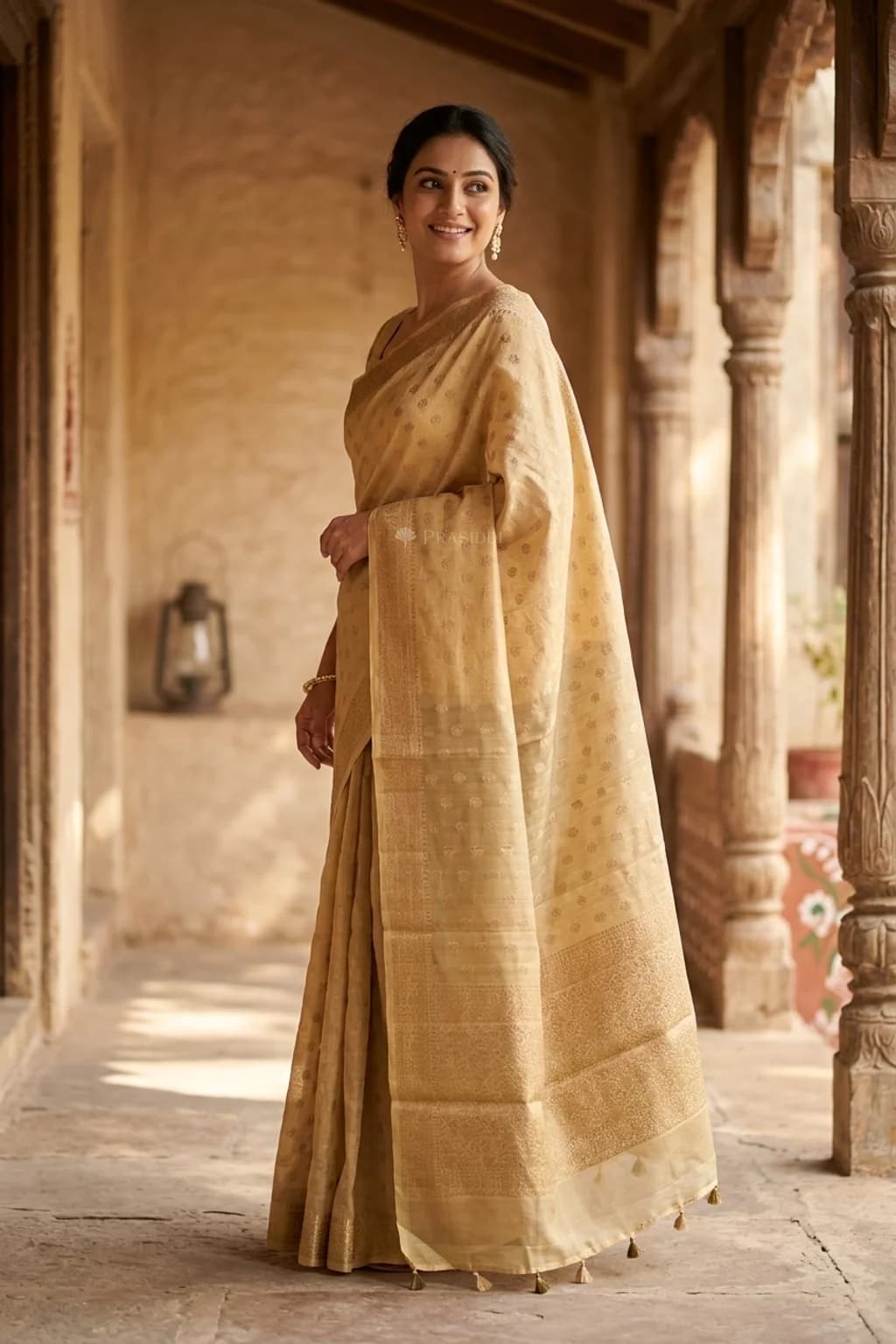 Cream Silk Cotton Saree with Butti Design and Classical Border – Model Displaying Full Saree