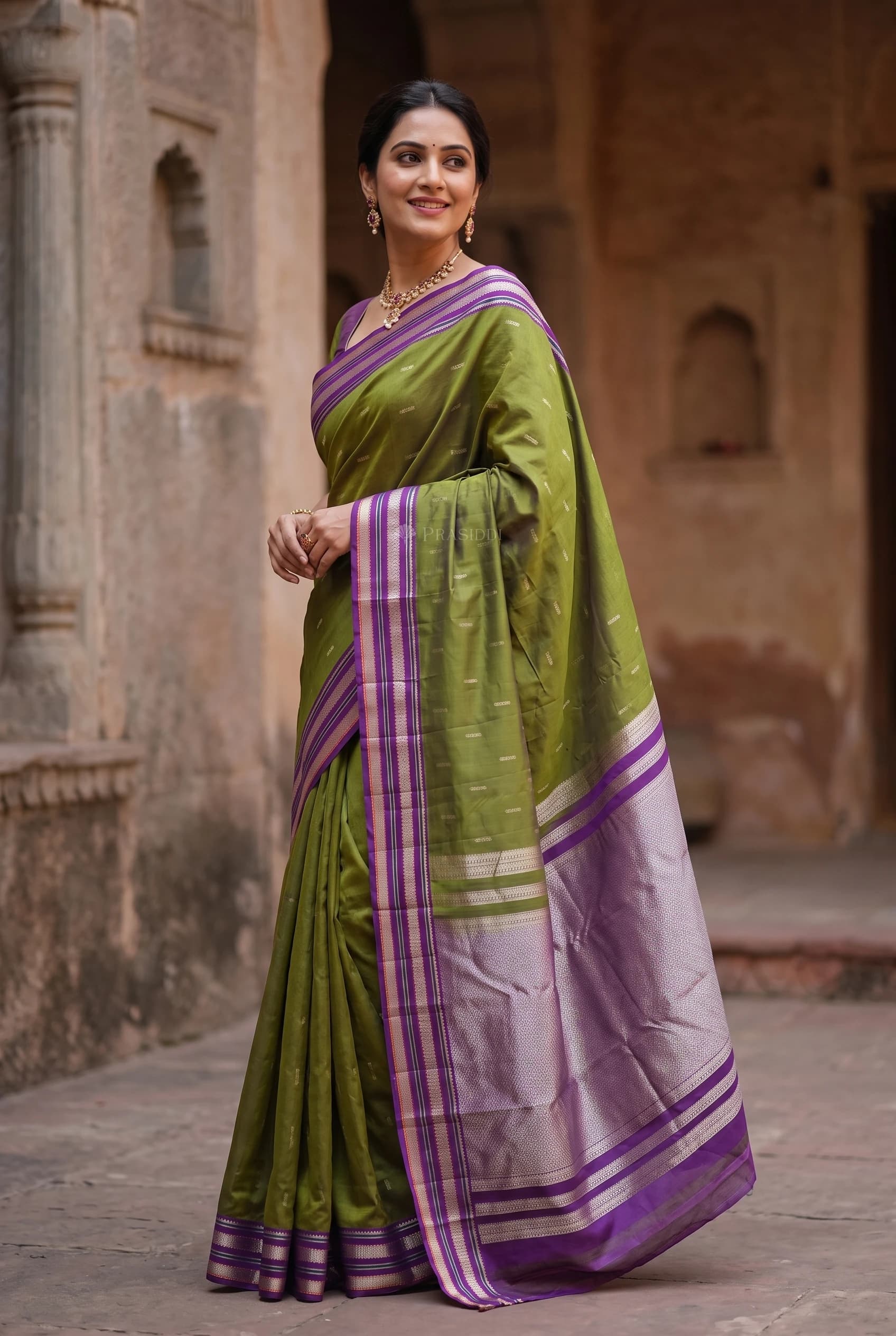 Moss Green and Violet Designer Silk Saree with Classical Border and Woven Motifs – Model Displaying Full Saree