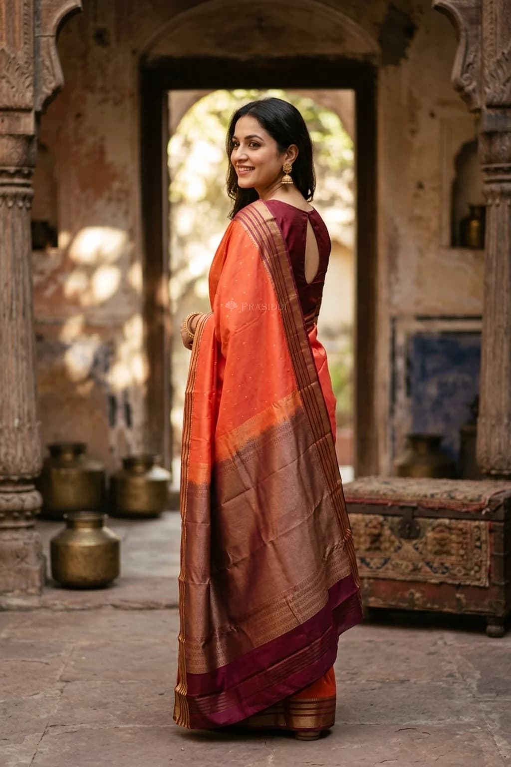Orange Maroon Butti Silk Saree with Contrast Border and Woven Motifs – Model Displaying Full Saree
