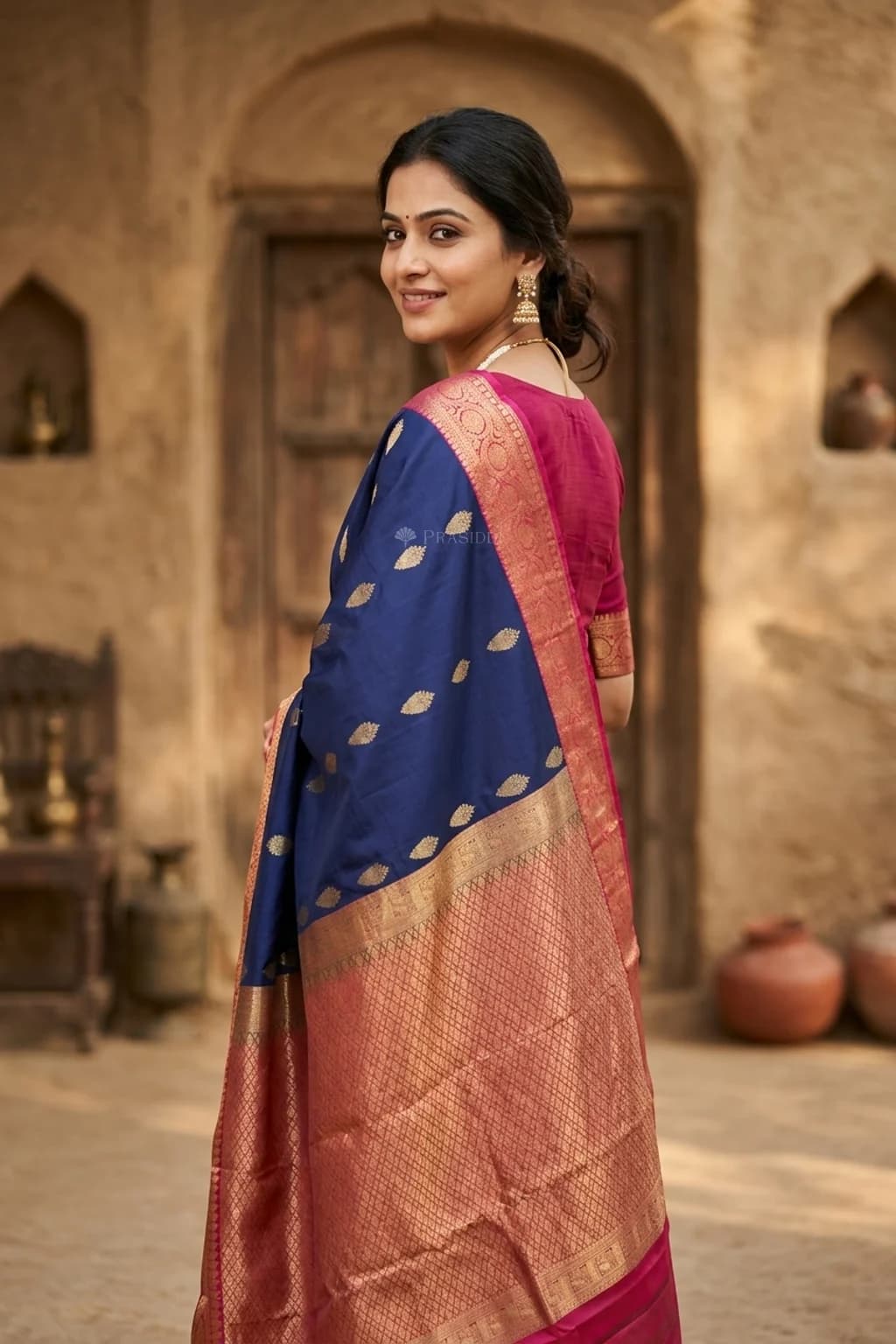 Royal Blue and Pink Silk Saree with Body Motifs and a Contrast Pink Border. – Model Displaying Full Saree
