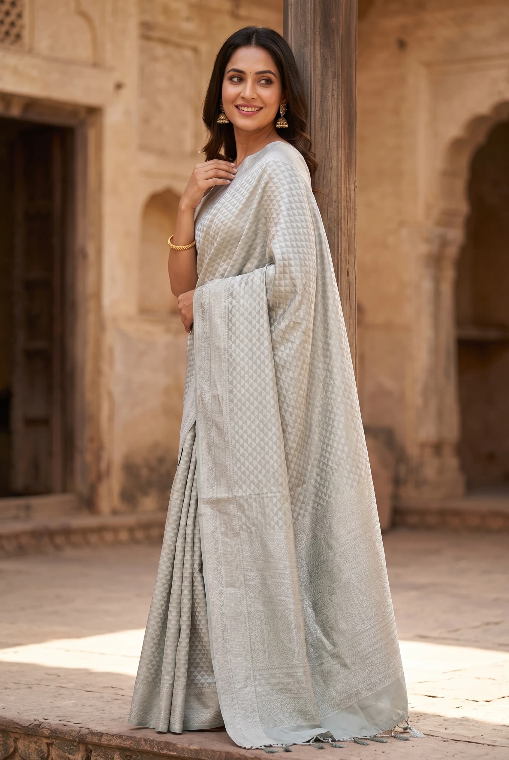 Silver Grey Soft Silk Saree with Woven Work and Butti Motifs and designer border border – Model Displaying Full Saree