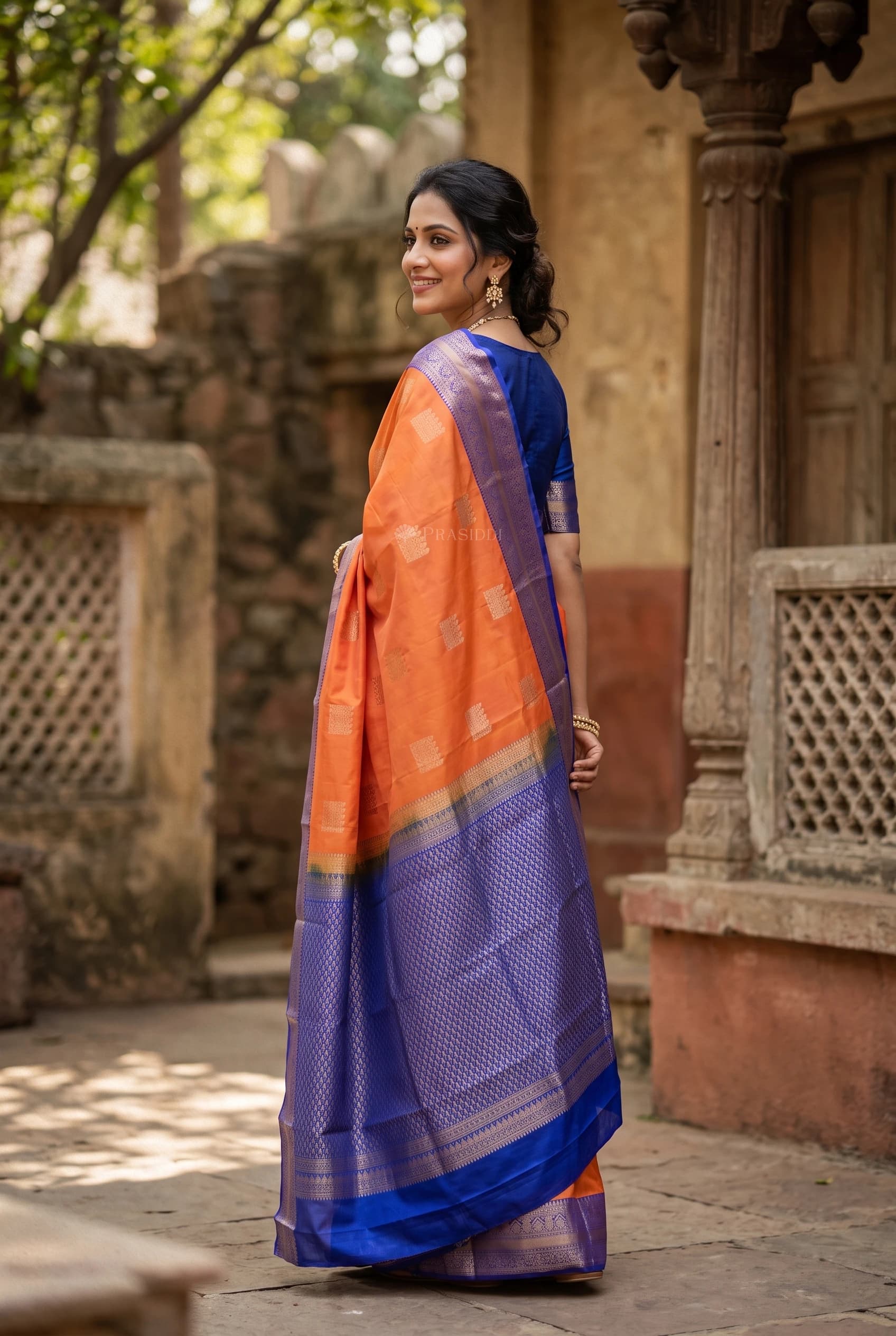 Orange and Cerulean Blue Traditional Silk Saree with Woven Zari Border – Model Displaying Full Saree