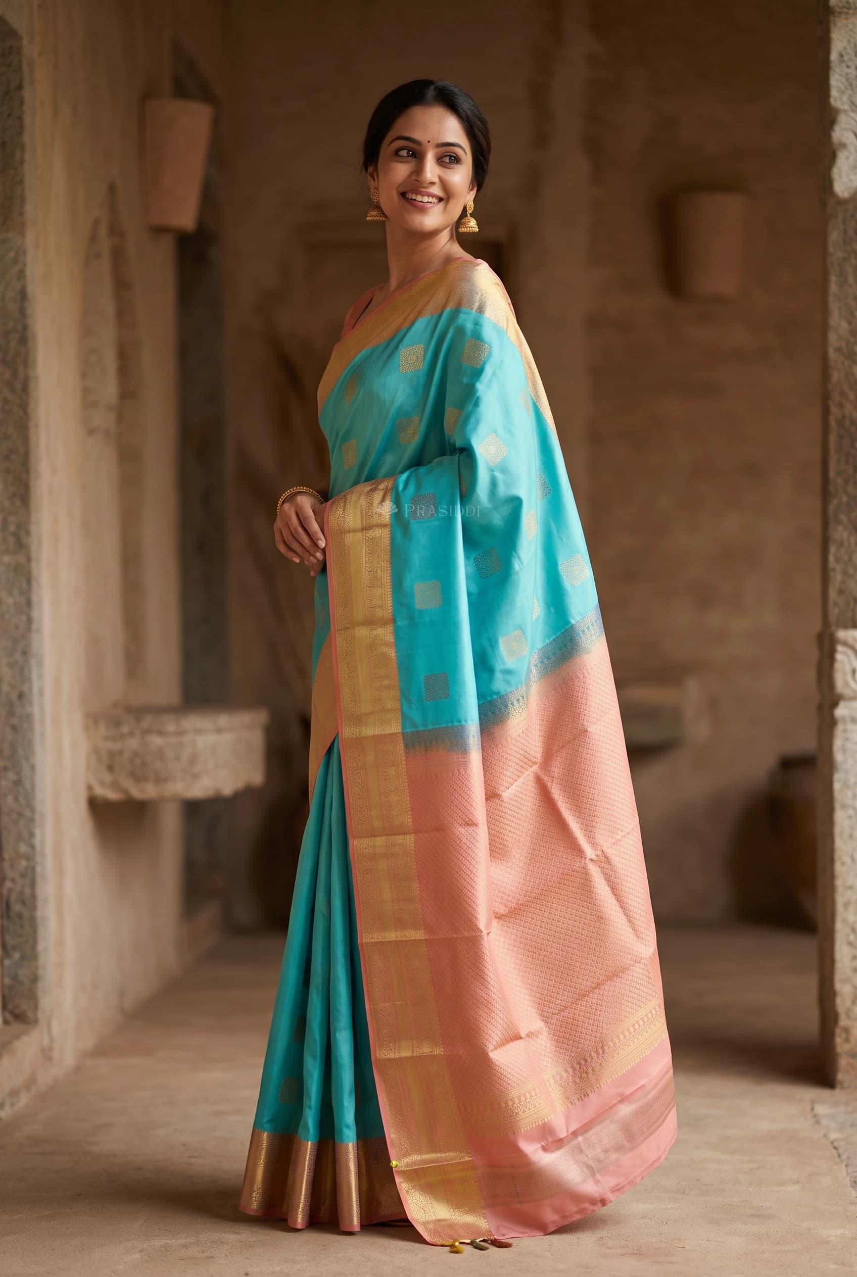 Turquoise Blue Silk Saree with Light Rust Contrast Woven Zari Border – Model Displaying Full Saree