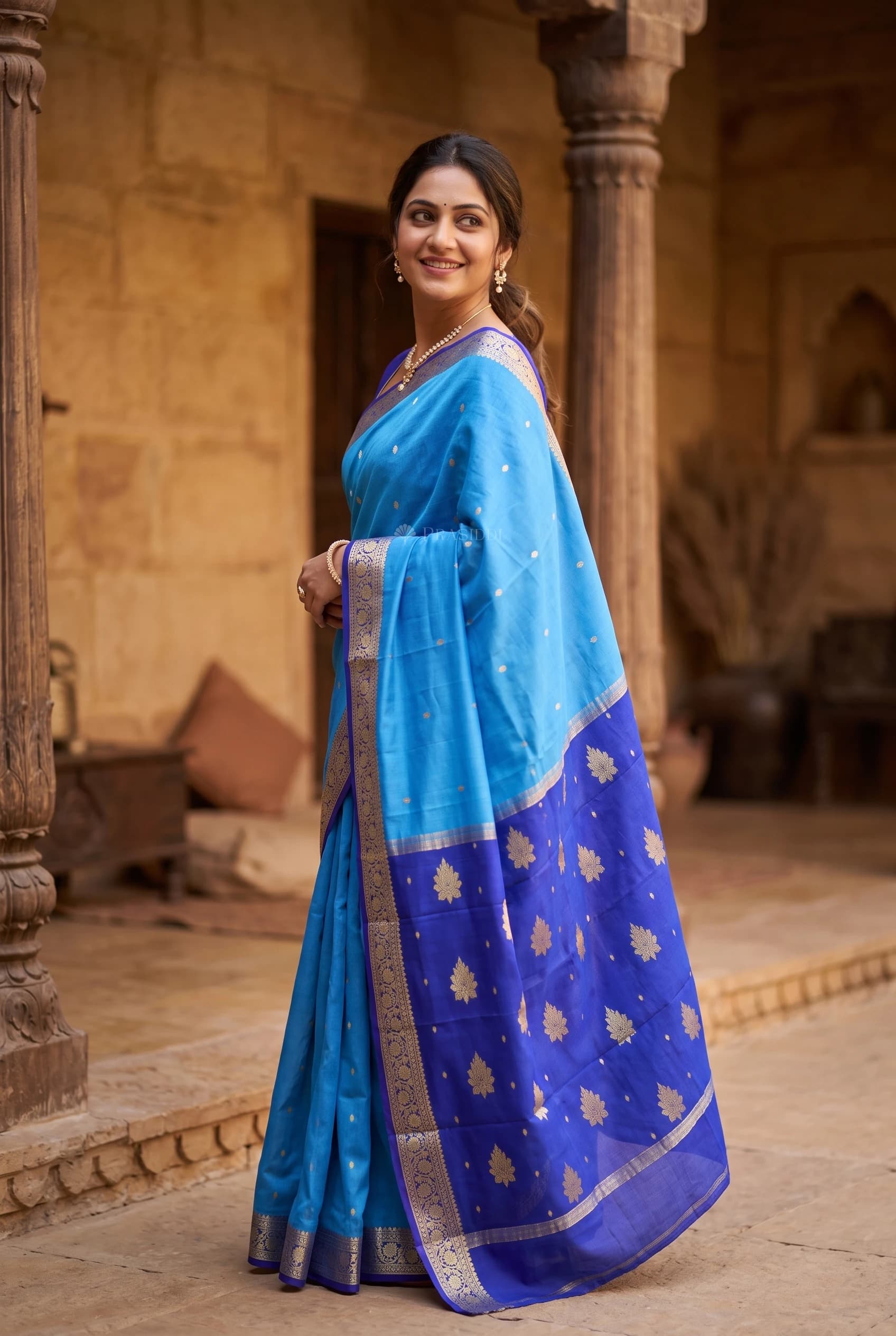 Blue & Royal Blue Mysore Silk Saree with Woven Work and Traditional Motifs and minimal border border – Model Displaying Full Saree