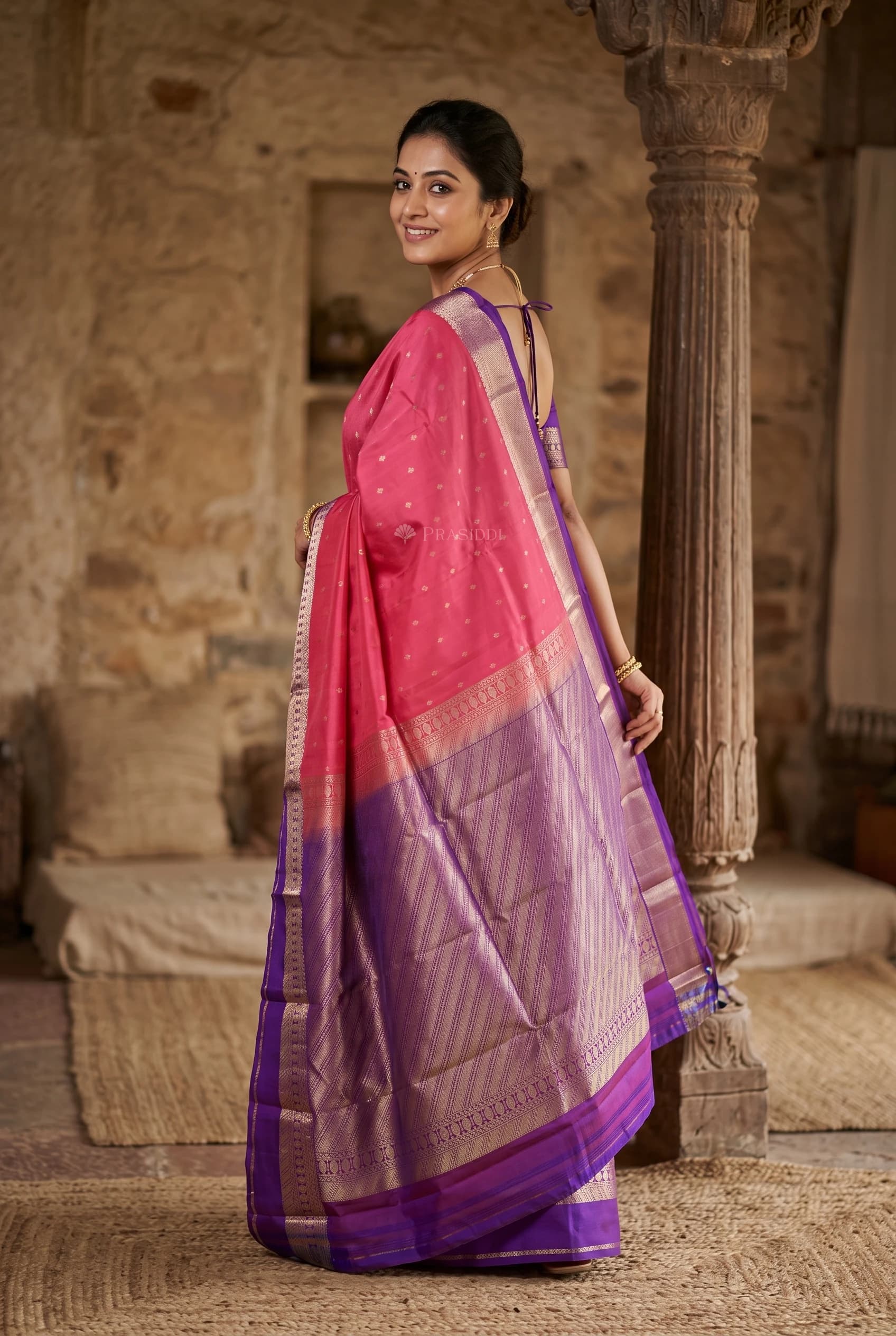 Pinkish Orange & Plum Silk Saree with Woven Work and Designer Motifs and contrast border border – Model Displaying Full Saree