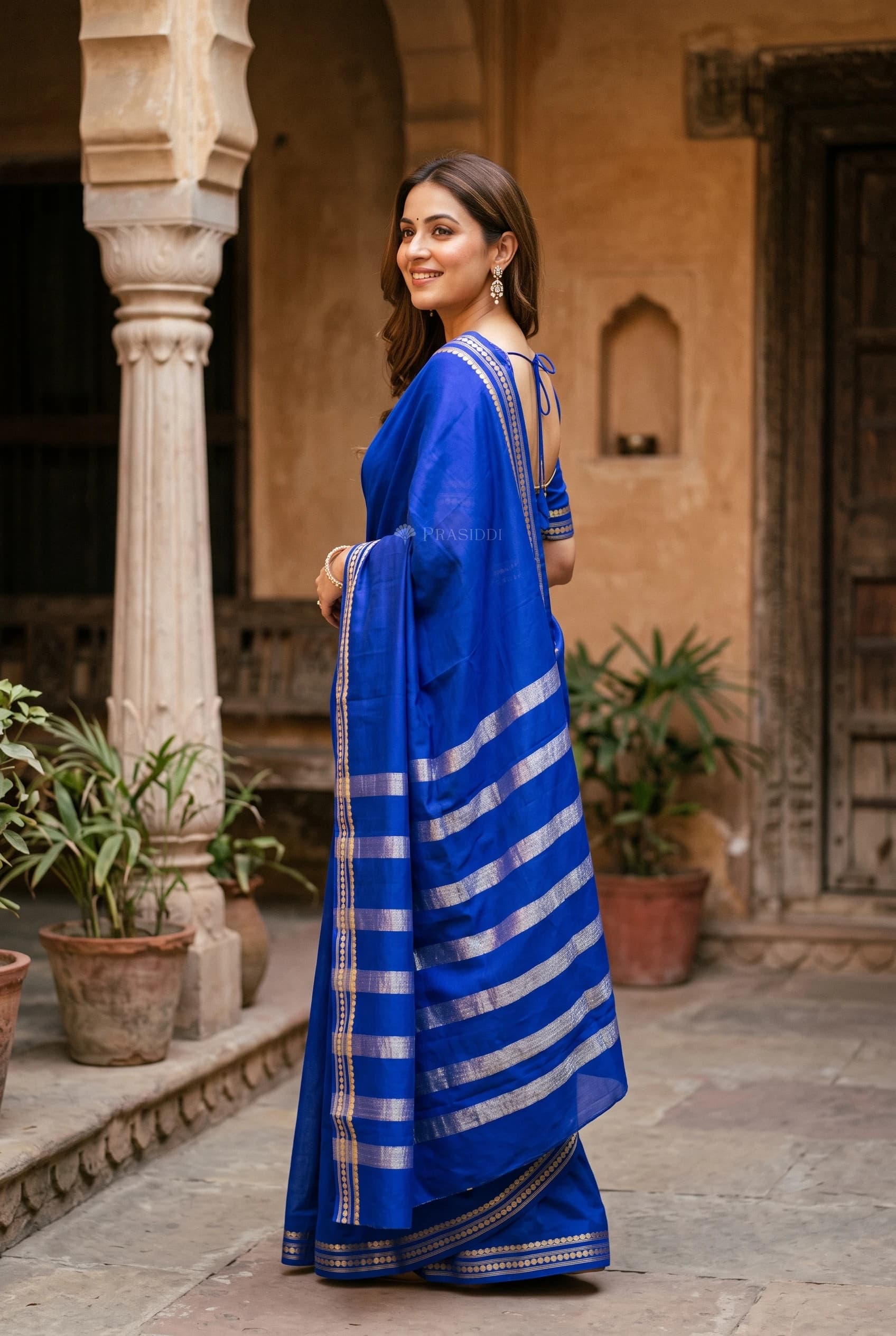 Royal Blue Mysore Silk Saree with Minimal Border and Woven Design. – Model Displaying Full Saree